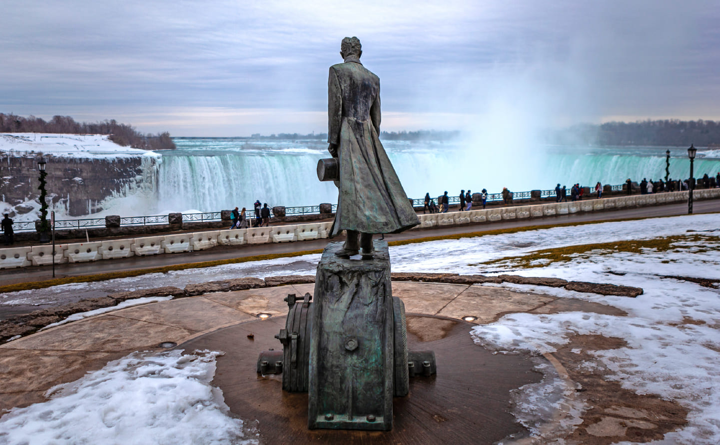 A statue of Nikola Tesla overlooks Niagara Falls from Queen Victoria Park